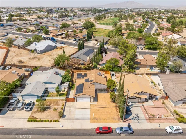 an aerial view of residential houses with outdoor space