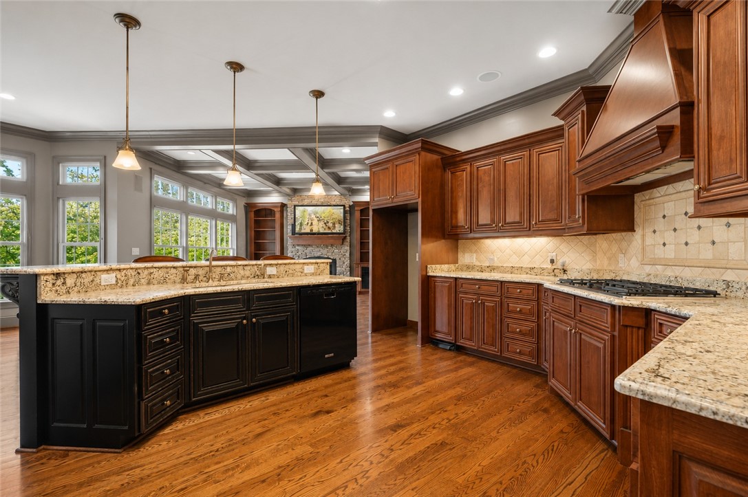 114 Willowbend Drive Anderson, SC 29621 - Photo 18 of 50 This spacious kitchen features warm wood cabinetry, granite countertops, and rich hardwood flooring.