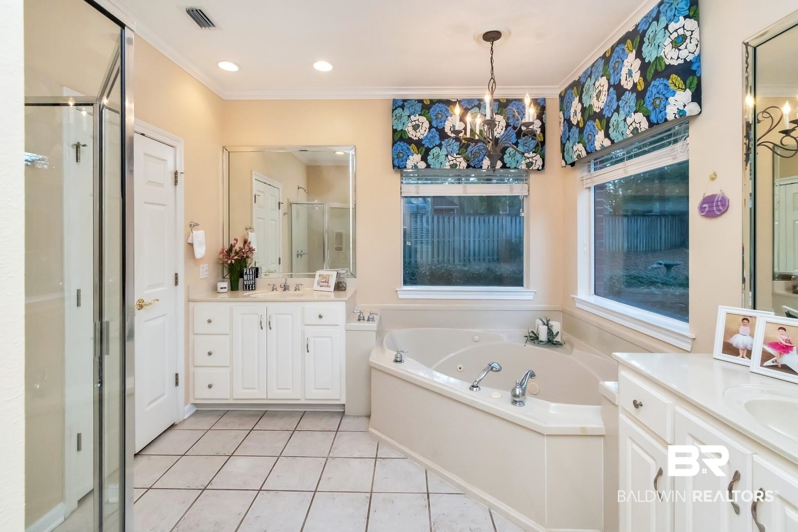1050 Southern Way Court Mobile, AL 36609 - Photo 14 of 36 Bathroom featuring tile patterned flooring, an inviting chandelier, vanity, ornamental molding, and shower with separate bathtub