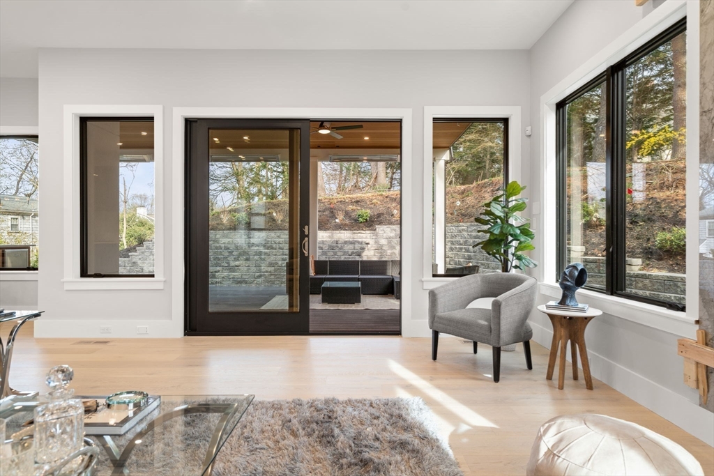 56 Upland Road Newton, MA 02468 - Photo 13 of 41 a living room with furniture and a large window