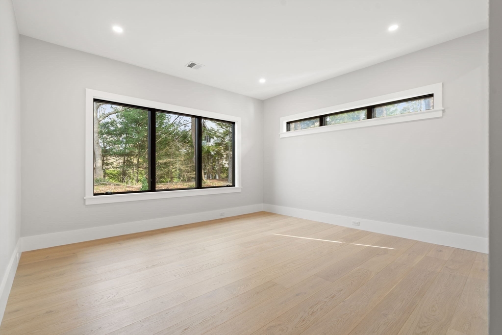 56 Upland Road Newton, MA 02468 - Photo 31 of 41 an empty room with windows