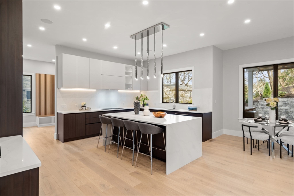 56 Upland Road Newton, MA 02468 - Photo 6 of 41 a kitchen with a table and chairs in it