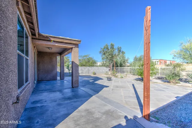 a view of a porch with a floor to ceiling window