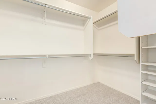 a view of an empty walk in closet