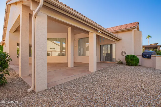 a view of a house with a small yard