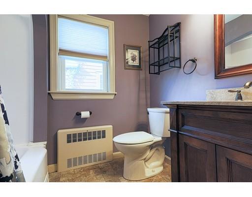 24 Devens Road Worcester, MA 01606 - Photo 14 of 25 a bathroom with a sink a toilet and a mirror
