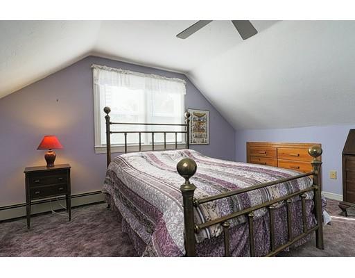 24 Devens Road Worcester, MA 01606 - Photo 16 of 25 a bedroom with a bed a dresser and next to a window