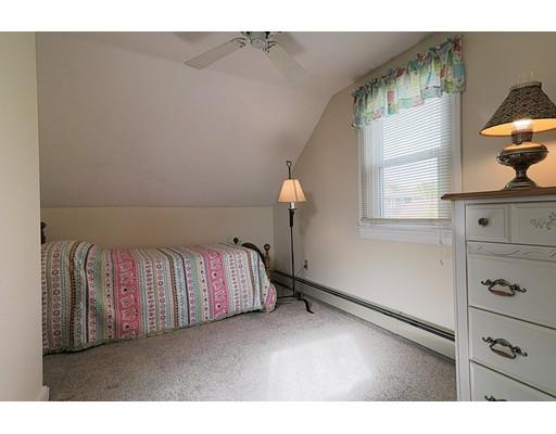 24 Devens Road Worcester, MA 01606 - Photo 17 of 25 a living room with a couch and a dresser