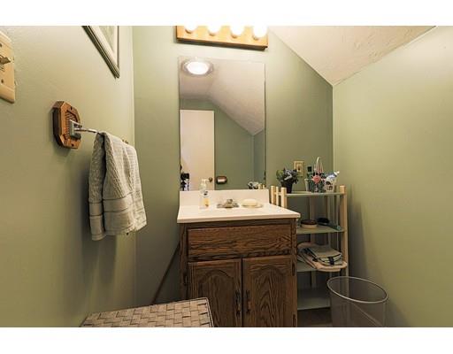 24 Devens Road Worcester, MA 01606 - Photo 19 of 25 a bathroom with a sink and mirror