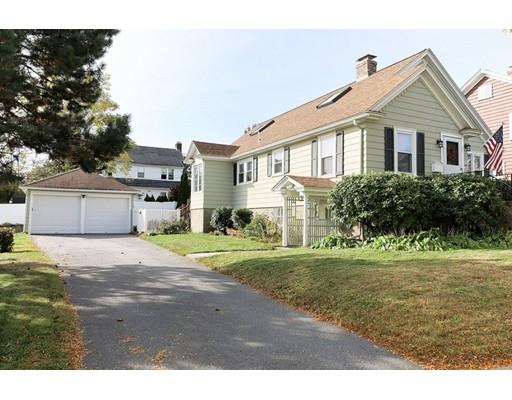 24 Devens Road Worcester, MA 01606 - Photo 2 of 25 a front view of a house with a yard and garage