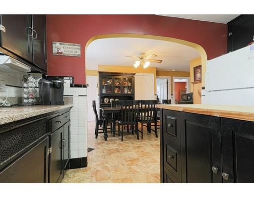 24 Devens Road Worcester, MA 01606 - Photo 7 of 25 a kitchen with stainless steel appliances granite countertop a sink and cabinets