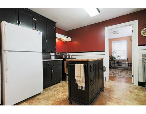 24 Devens Road Worcester, MA 01606 - Photo 8 of 25 a kitchen with refrigerator a washer and dryer