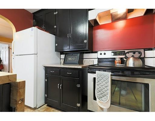 24 Devens Road Worcester, MA 01606 - Photo 9 of 25 a kitchen with a cabinets and appliances
