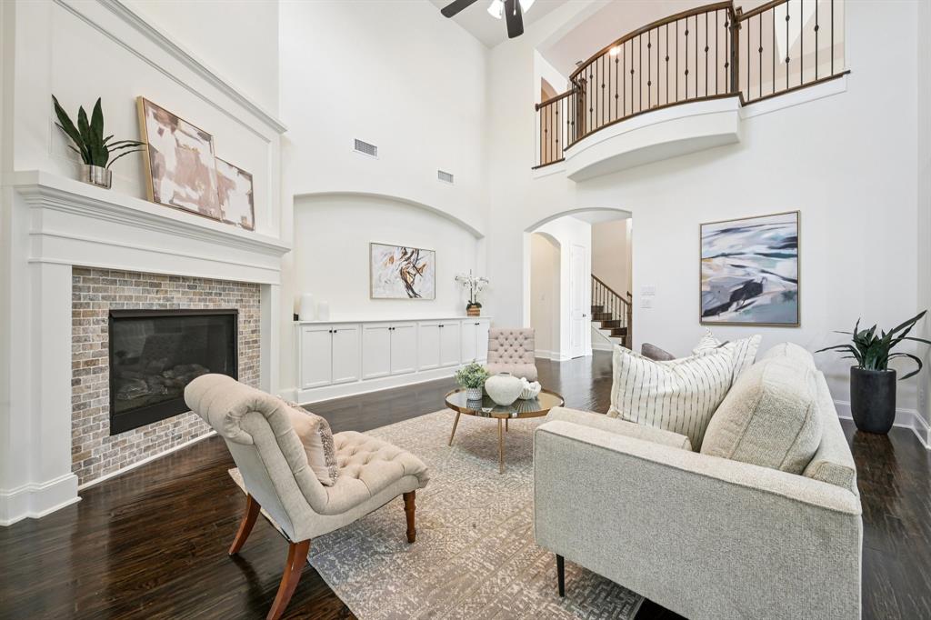 2029 Temperate Drive Allen, TX 75013 - Photo 5 of 40 a living room with furniture and a fireplace