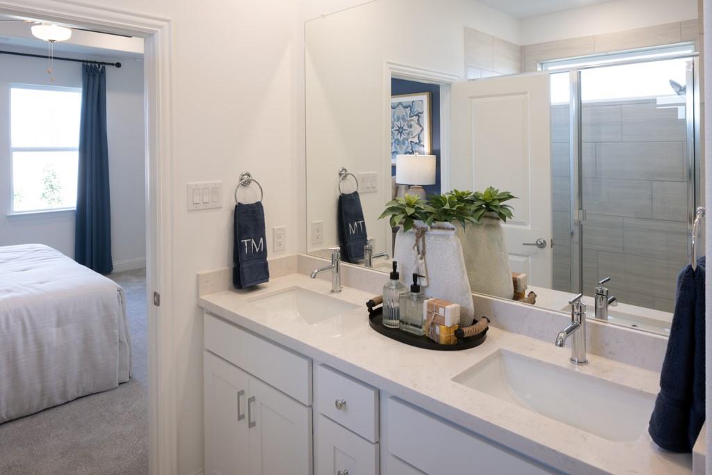 15009 Horseshoe Post Road Fort Worth, TX 76052 - Photo 13 of 25 a bathroom with a sink double vanity and a mirror