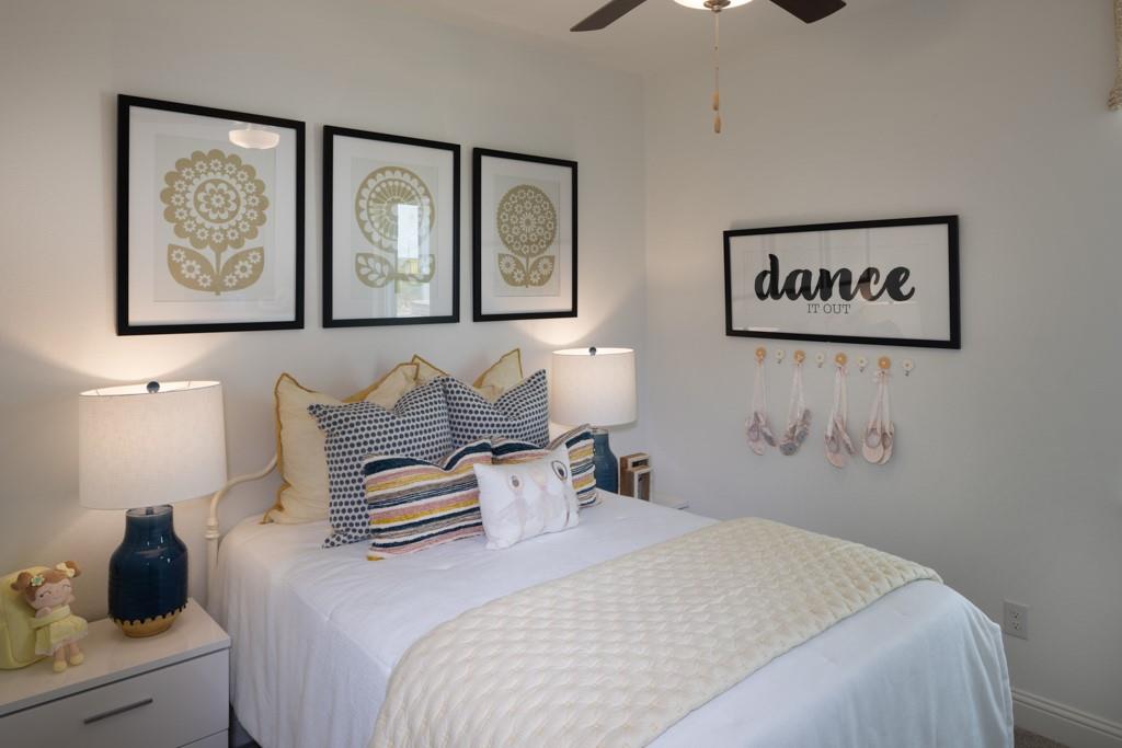 15009 Horseshoe Post Road Fort Worth, TX 76052 - Photo 9 of 25 a bedroom with a bed and a painting on the wall