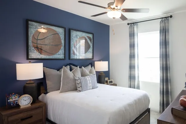a dining room with furniture and a potted plant