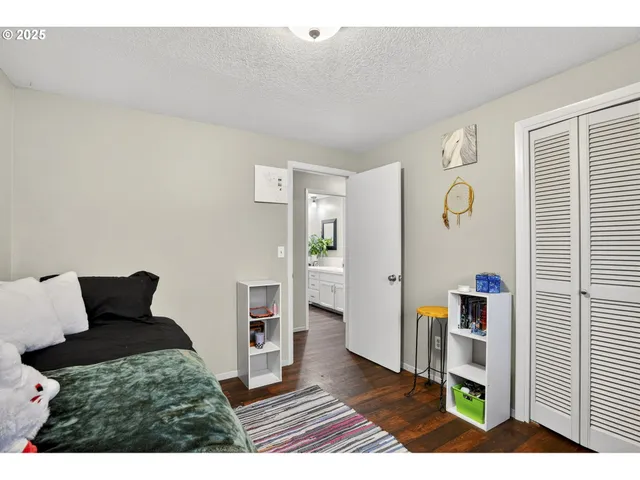 a bedroom with furniture and a window