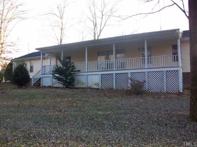 7112 Blalock Road Bahama, NC 27503 - Photo 1 of 12 a view of a house with a yard