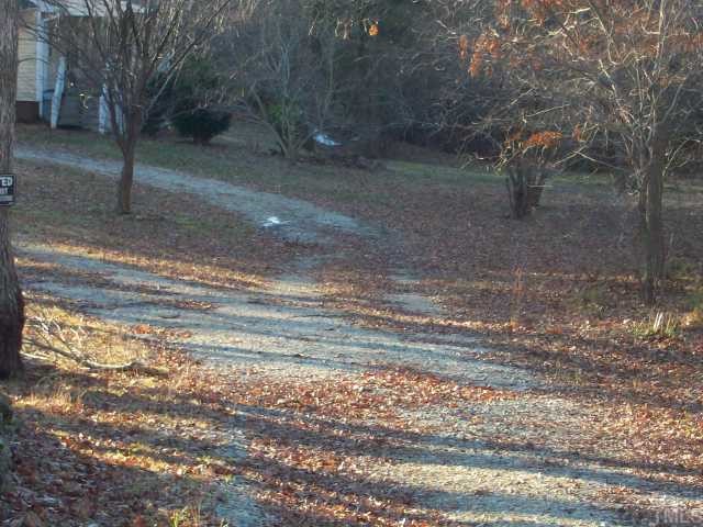 7112 Blalock Road Bahama, NC 27503 - Photo 6 of 12 a backyard of a house with lots of green space
