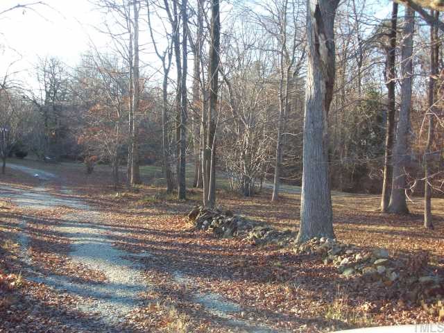 7112 Blalock Road Bahama, NC 27503 - Photo 7 of 12 a backyard of a house with lots of green space