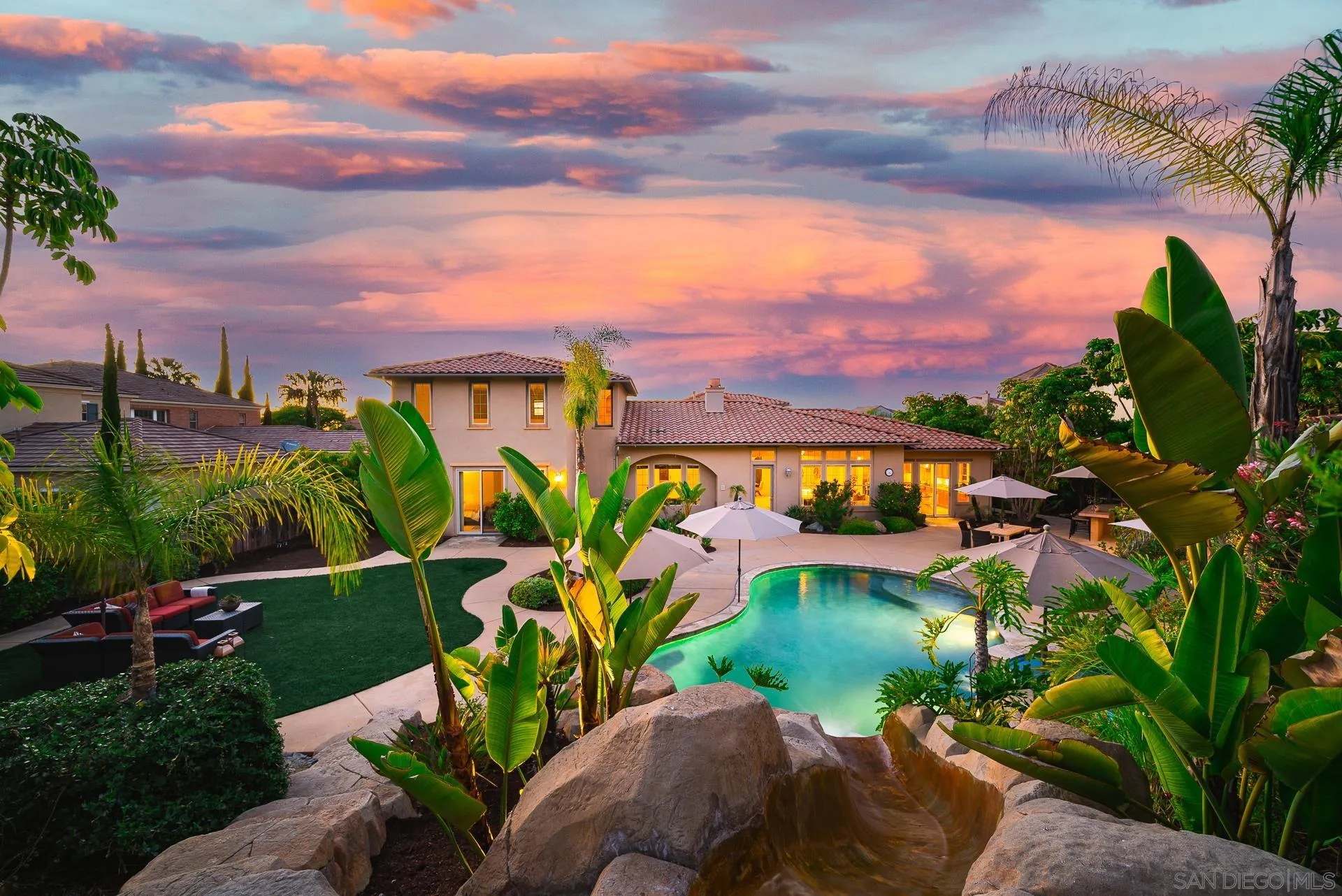 a view of a swimming pool with a garden