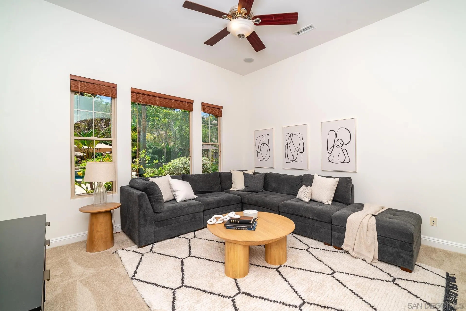 14757 Whispering Ridge Road San Diego, CA 92131 - Photo 14 of 48 a living room with furniture and a large window