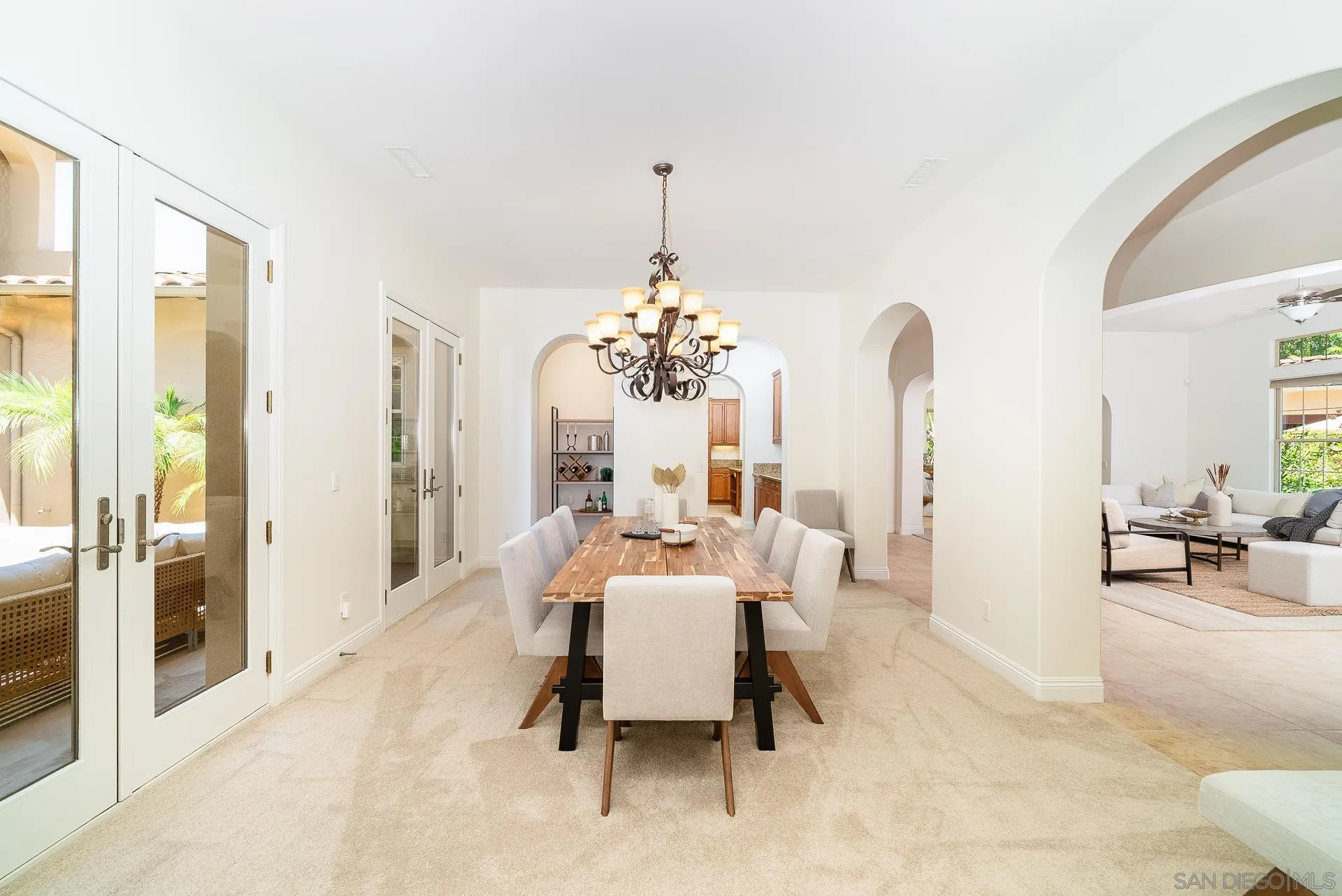 14757 Whispering Ridge Road San Diego, CA 92131 - Photo 15 of 48 a living room with furniture and a chandelier