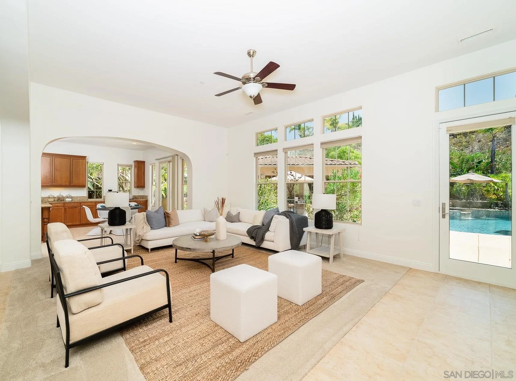 14757 Whispering Ridge Road San Diego, CA 92131 - Photo 16 of 48 a living room with furniture and a large window