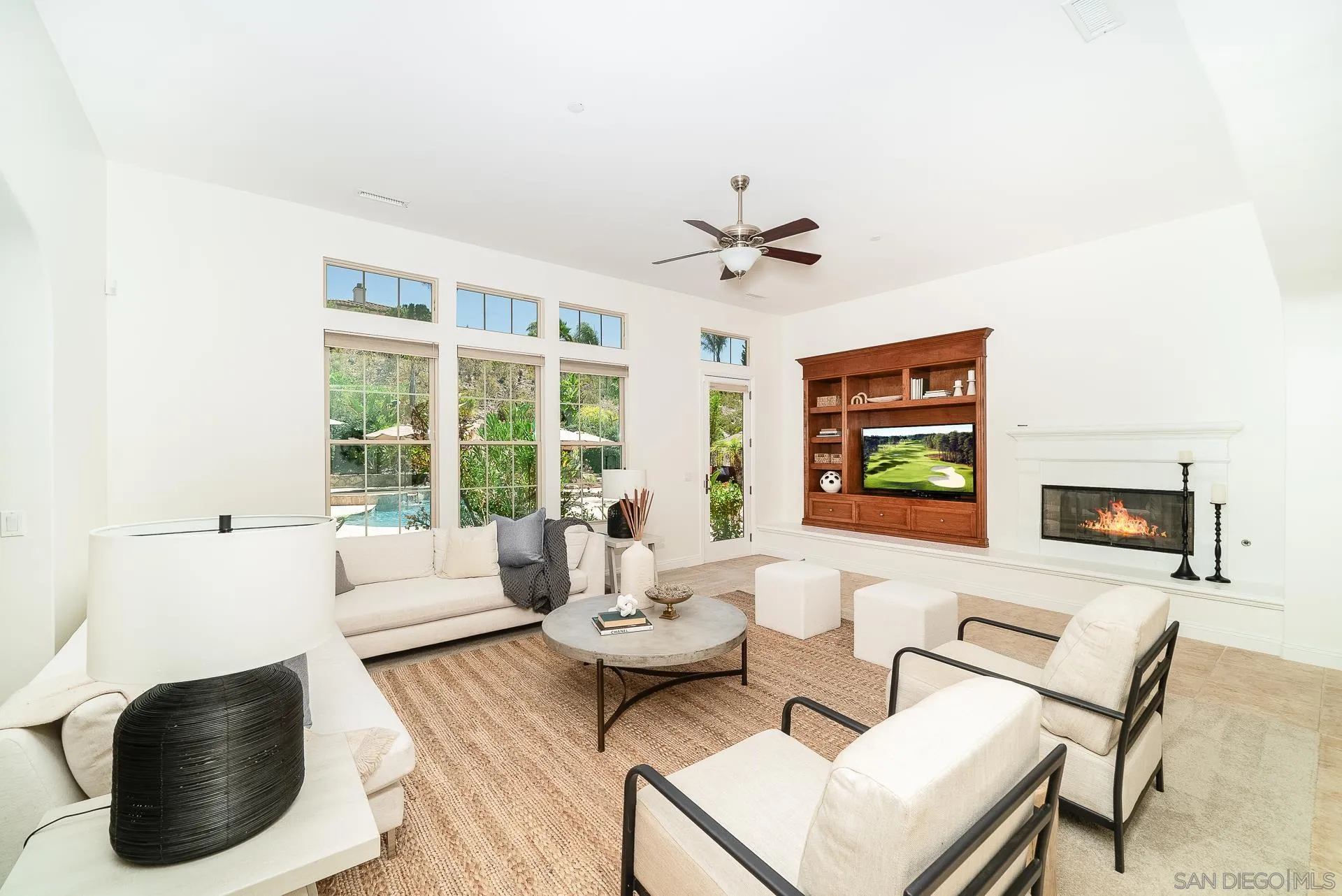14757 Whispering Ridge Road San Diego, CA 92131 - Photo 18 of 48 a living room with furniture and a flat screen tv