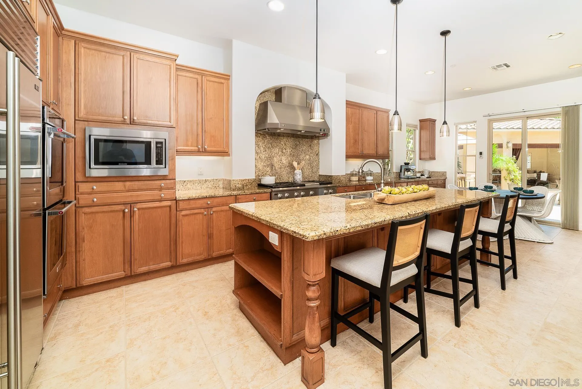 14757 Whispering Ridge Road San Diego, CA 92131 - Photo 25 of 48 a kitchen with a stove a sink and a refrigerator