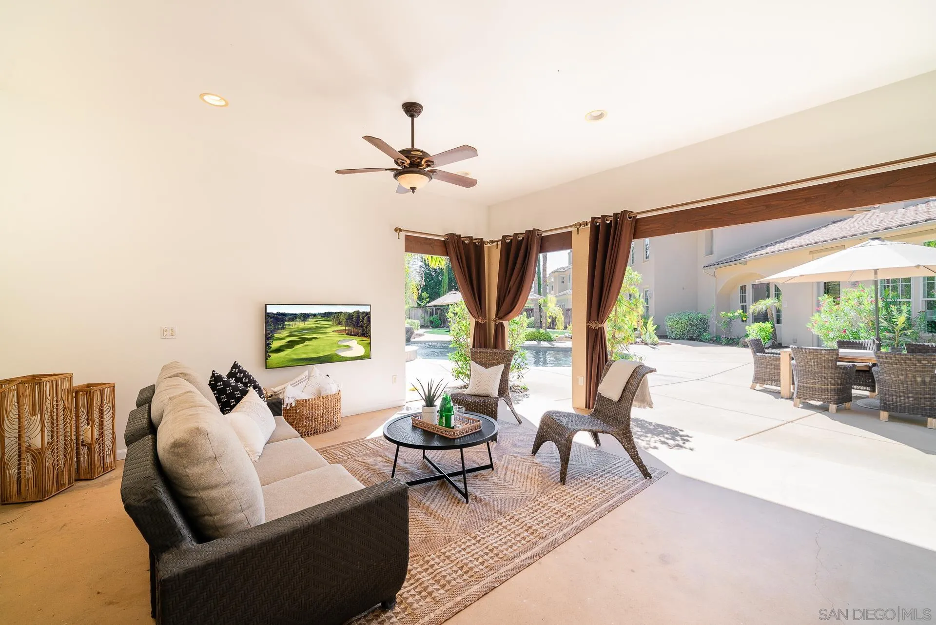 14757 Whispering Ridge Road San Diego, CA 92131 - Photo 31 of 48 a living room with furniture and a large window
