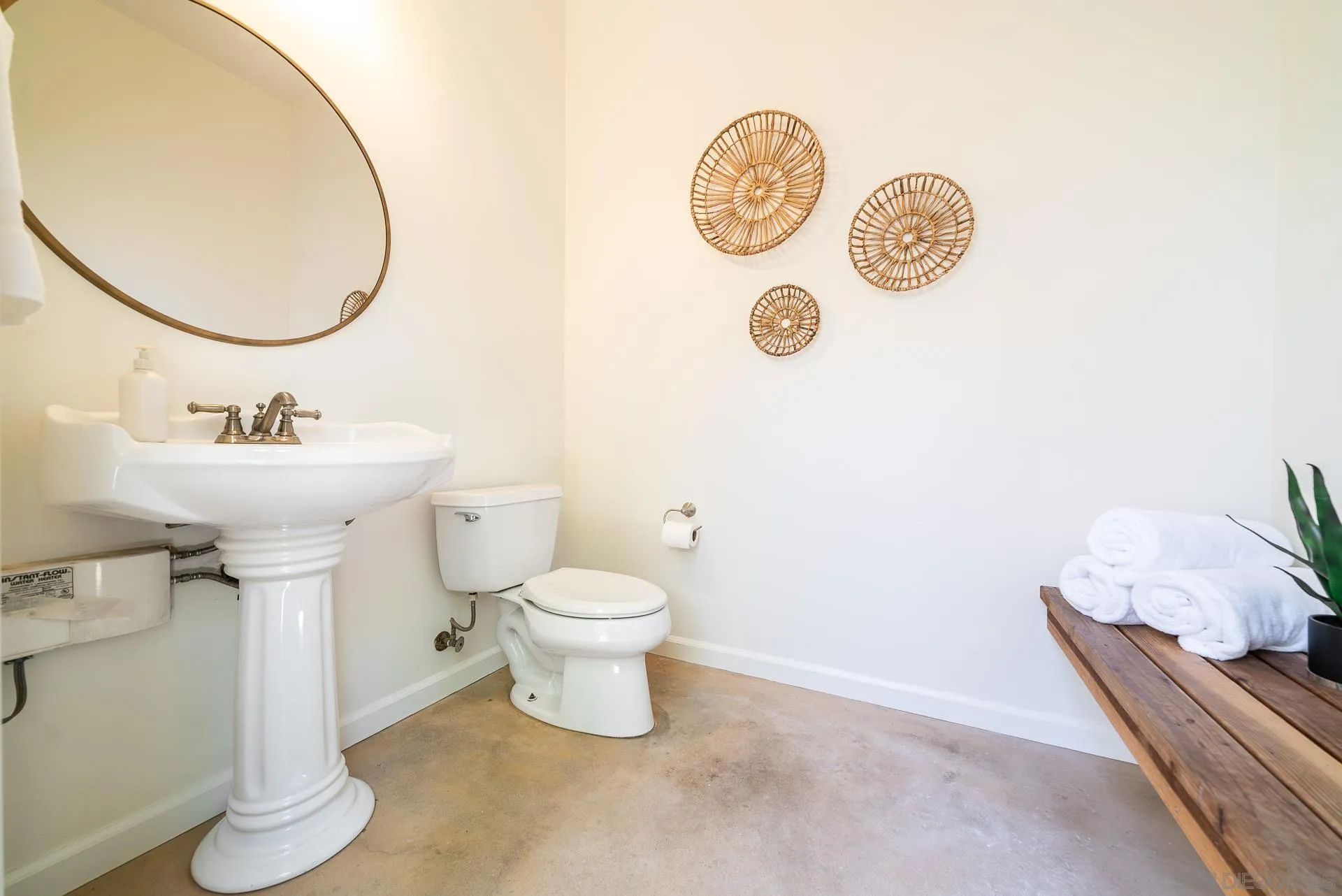 14757 Whispering Ridge Road San Diego, CA 92131 - Photo 32 of 48 a bathroom with a sink mirror and toilet