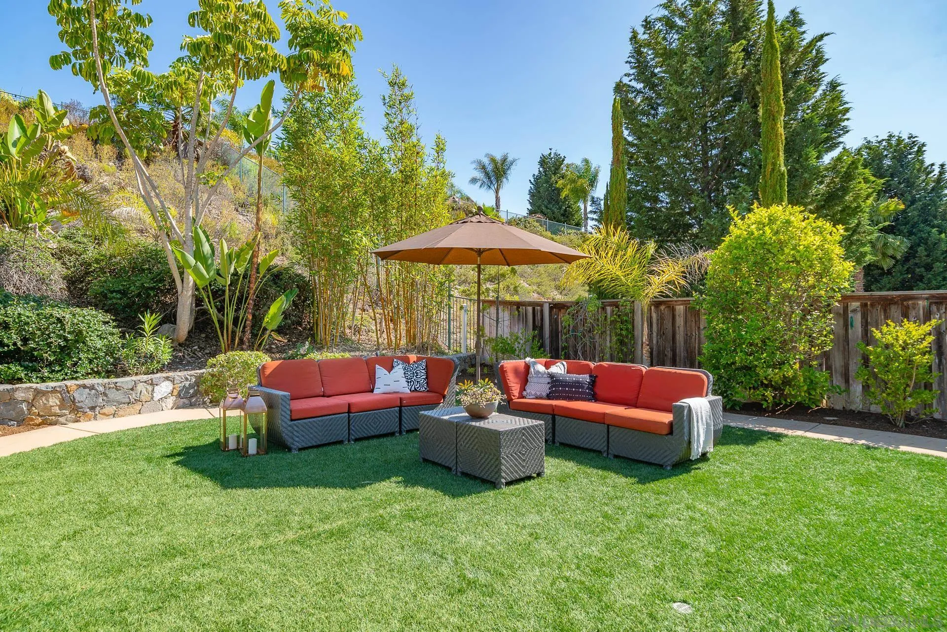 14757 Whispering Ridge Road San Diego, CA 92131 - Photo 37 of 48 a backyard of a house with table and chairs