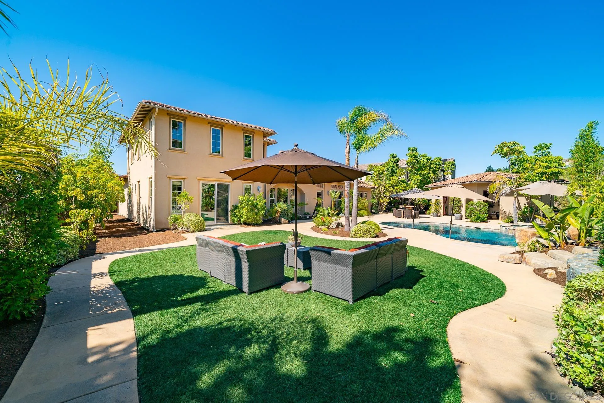14757 Whispering Ridge Road San Diego, CA 92131 - Photo 44 of 48 a front view of a house with garden