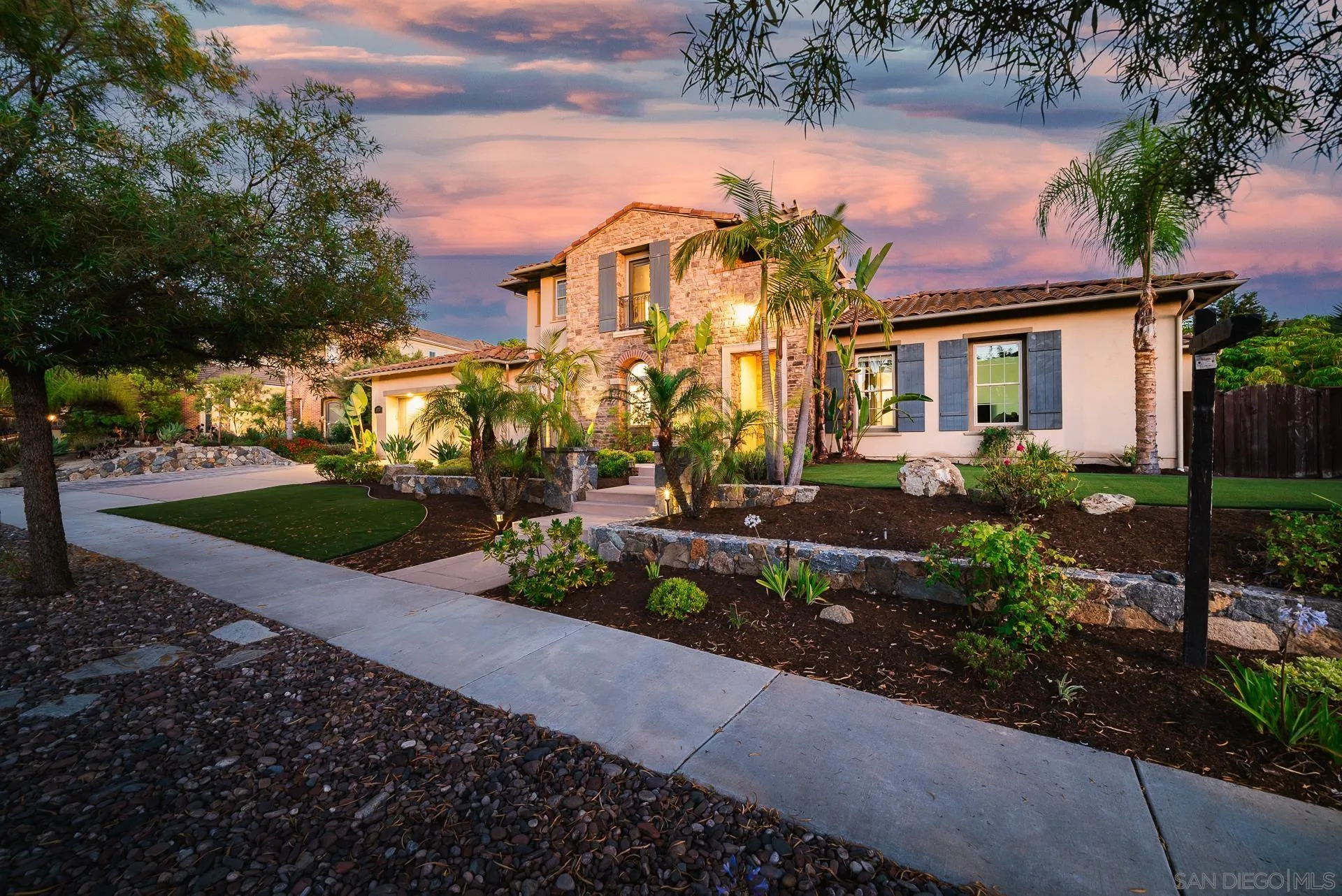 14757 Whispering Ridge Road San Diego, CA 92131 - Photo 47 of 48 a front view of a house with a yard and potted plants