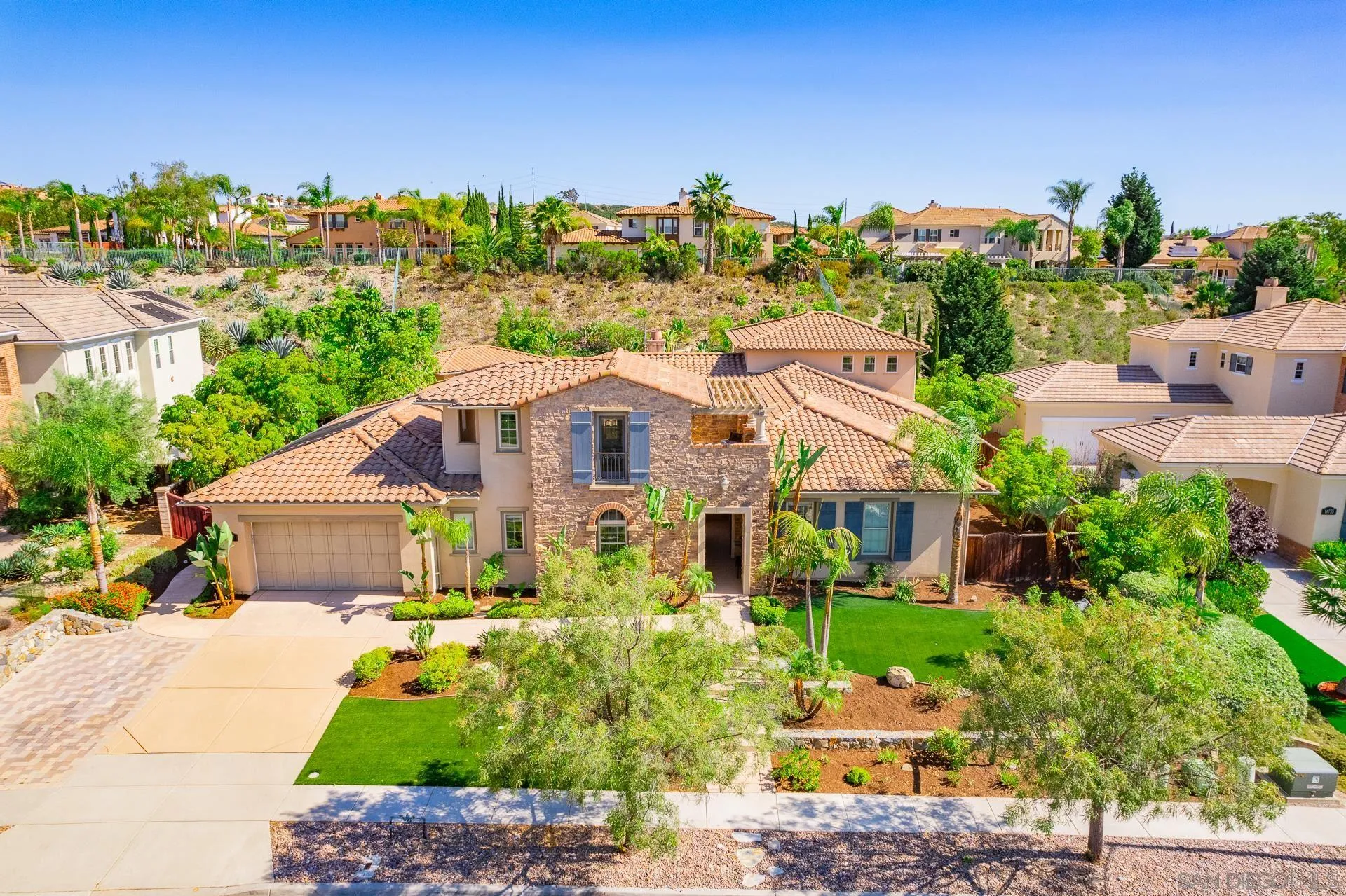 14757 Whispering Ridge Road San Diego, CA 92131 - Photo 6 of 48 a front view of a house with a yard