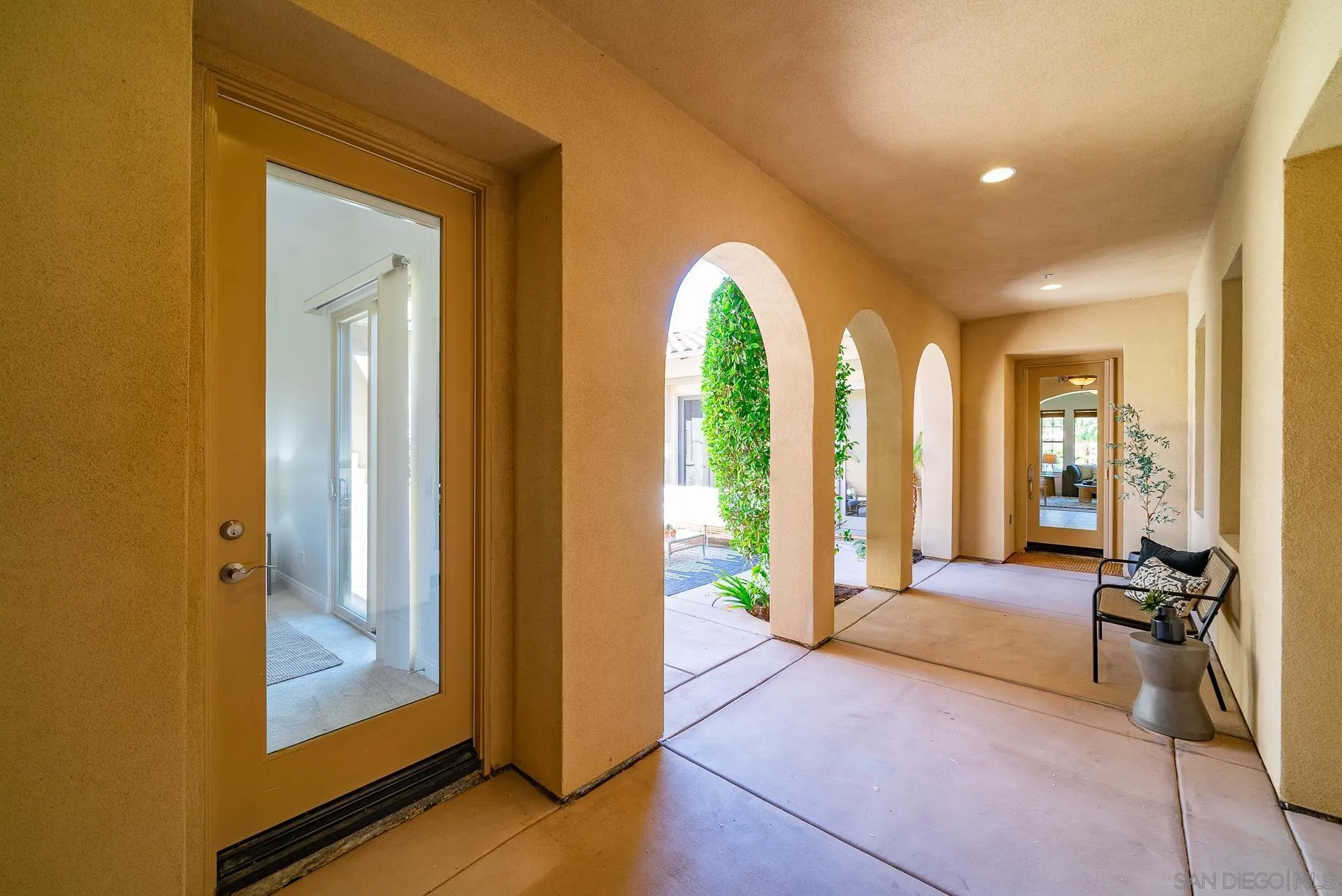 14757 Whispering Ridge Road San Diego, CA 92131 - Photo 8 of 48 a view of a hallway with furniture and windows