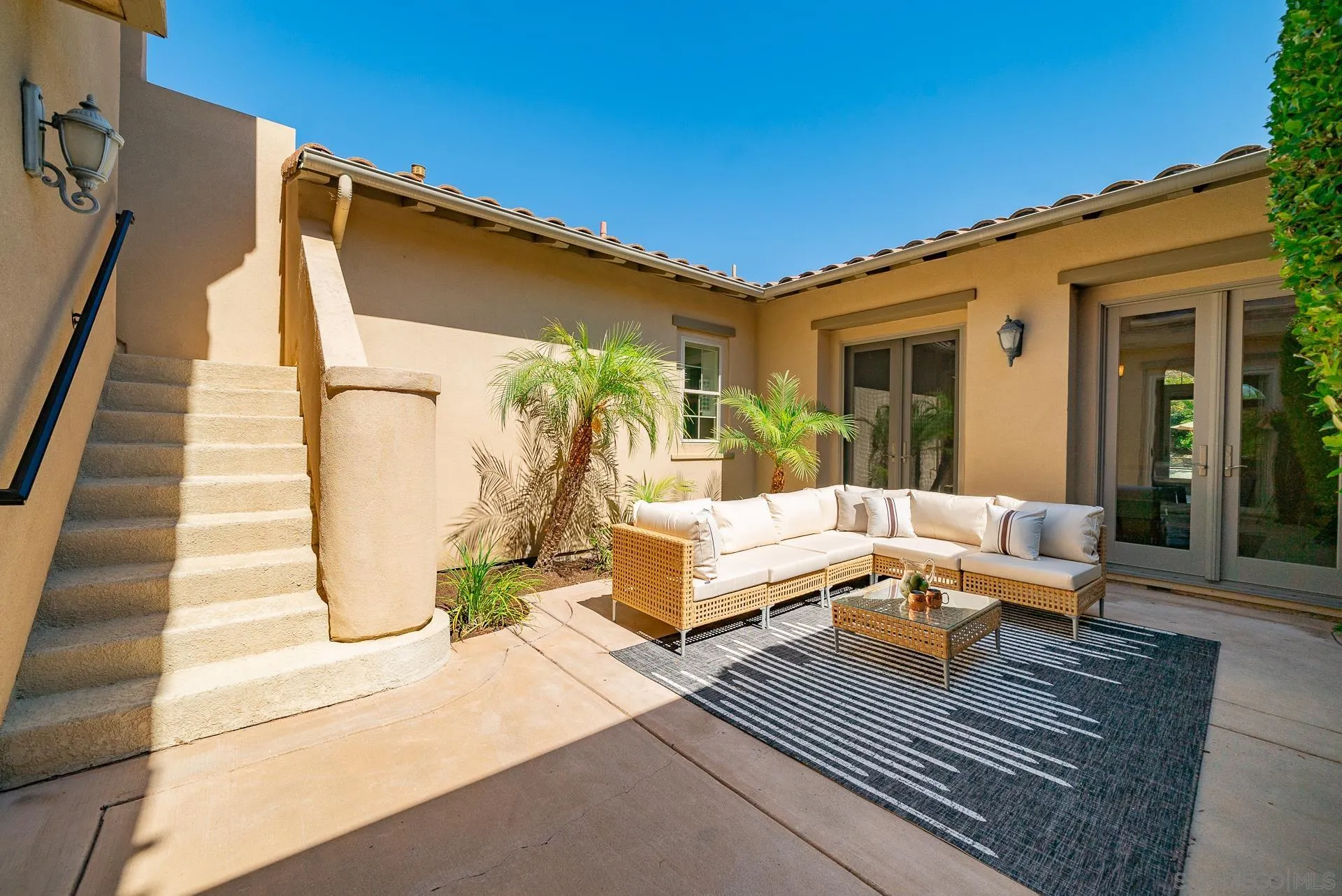 14757 Whispering Ridge Road San Diego, CA 92131 - Photo 9 of 48 a building outdoor space with patio furniture