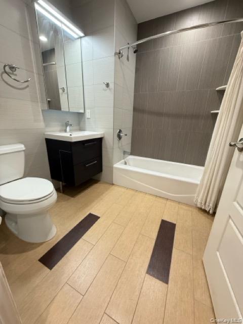 31-10 28th Road, Unit 3D Queens, NY 11102 - Photo 5 of 11 a bathroom with a sink a toilet and shower