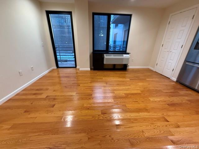 31-10 28th Road, Unit 3D Queens, NY 11102 - Photo 10 of 11 a view of empty room with wooden floor