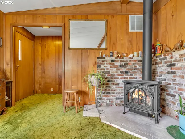 a view of a porch with a door and a chair
