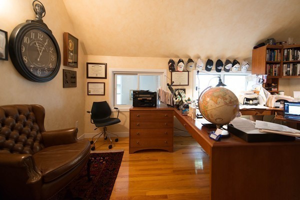 8 Frost Street Natick, MA 01760 - Photo 21 of 28 a living room with furniture a rug and a fireplace