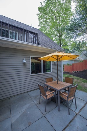 8 Frost Street Natick, MA 01760 - Photo 25 of 28 a backyard of a house with swimming pool and outdoor seating