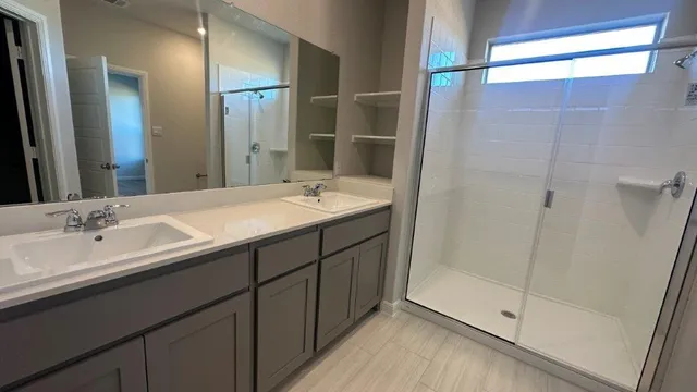 a bathroom with a sink and mirror