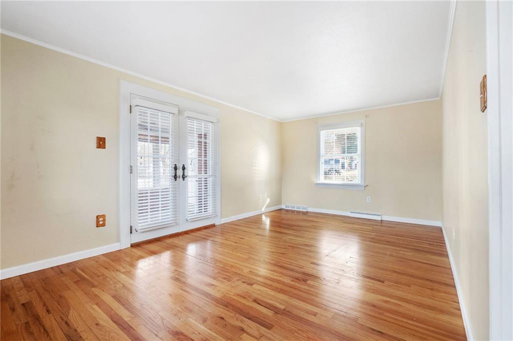 111 Lansdowne Drive Coraopolis, PA 15108 - Photo 21 of 42 an empty room with wooden floor and windows