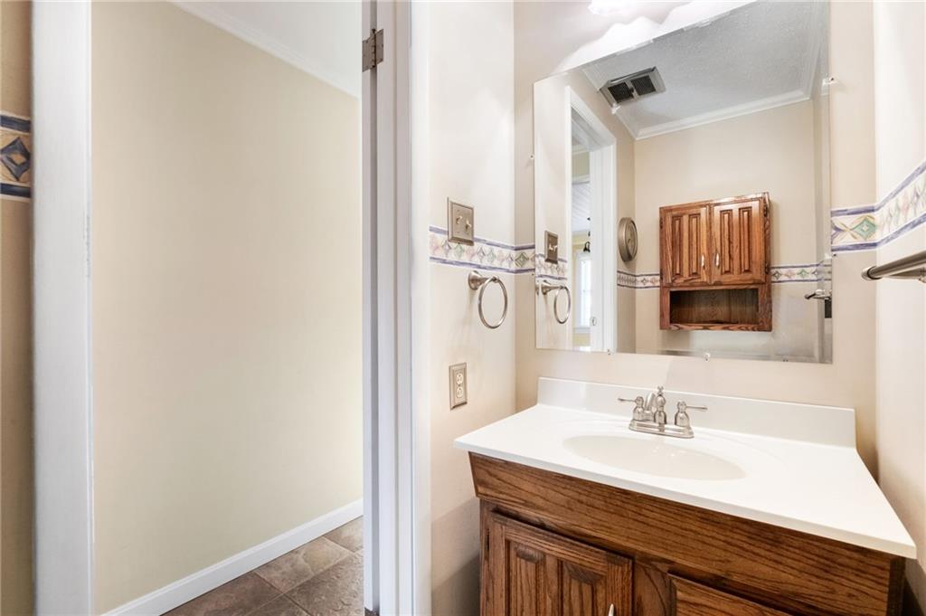 111 Lansdowne Drive Coraopolis, PA 15108 - Photo 25 of 42 a bathroom with a sink and a mirror