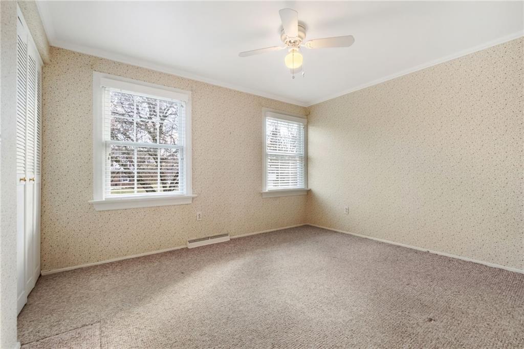 111 Lansdowne Drive Coraopolis, PA 15108 - Photo 32 of 42 an empty room with windows and fan