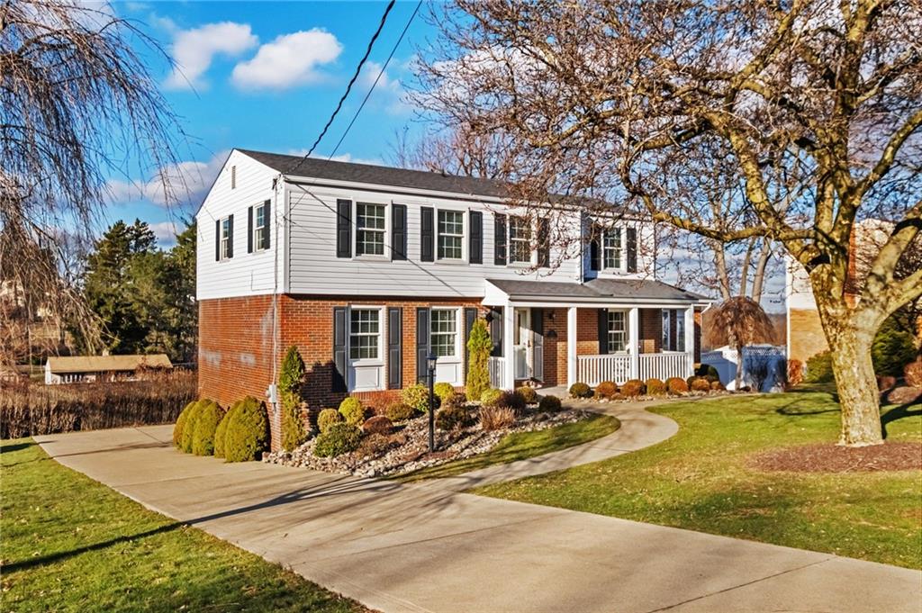 111 Lansdowne Drive Coraopolis, PA 15108 - Photo 4 of 42 a front view of a house with a garden