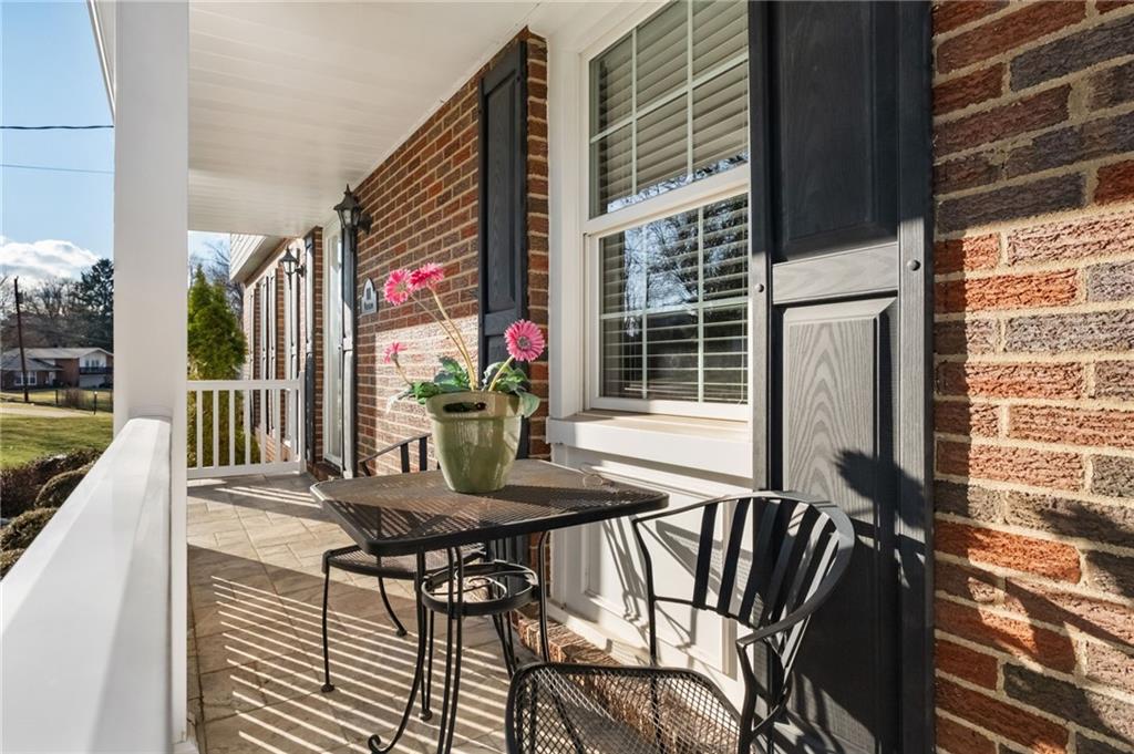 111 Lansdowne Drive Coraopolis, PA 15108 - Photo 7 of 42 a view of balcony with a dining table and chairs with wooden floor